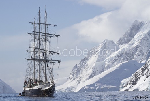 Picture of Tourist ship sailing summer day on a background of mountain peak